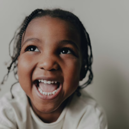 Close-up Photo of a Smiling Girl