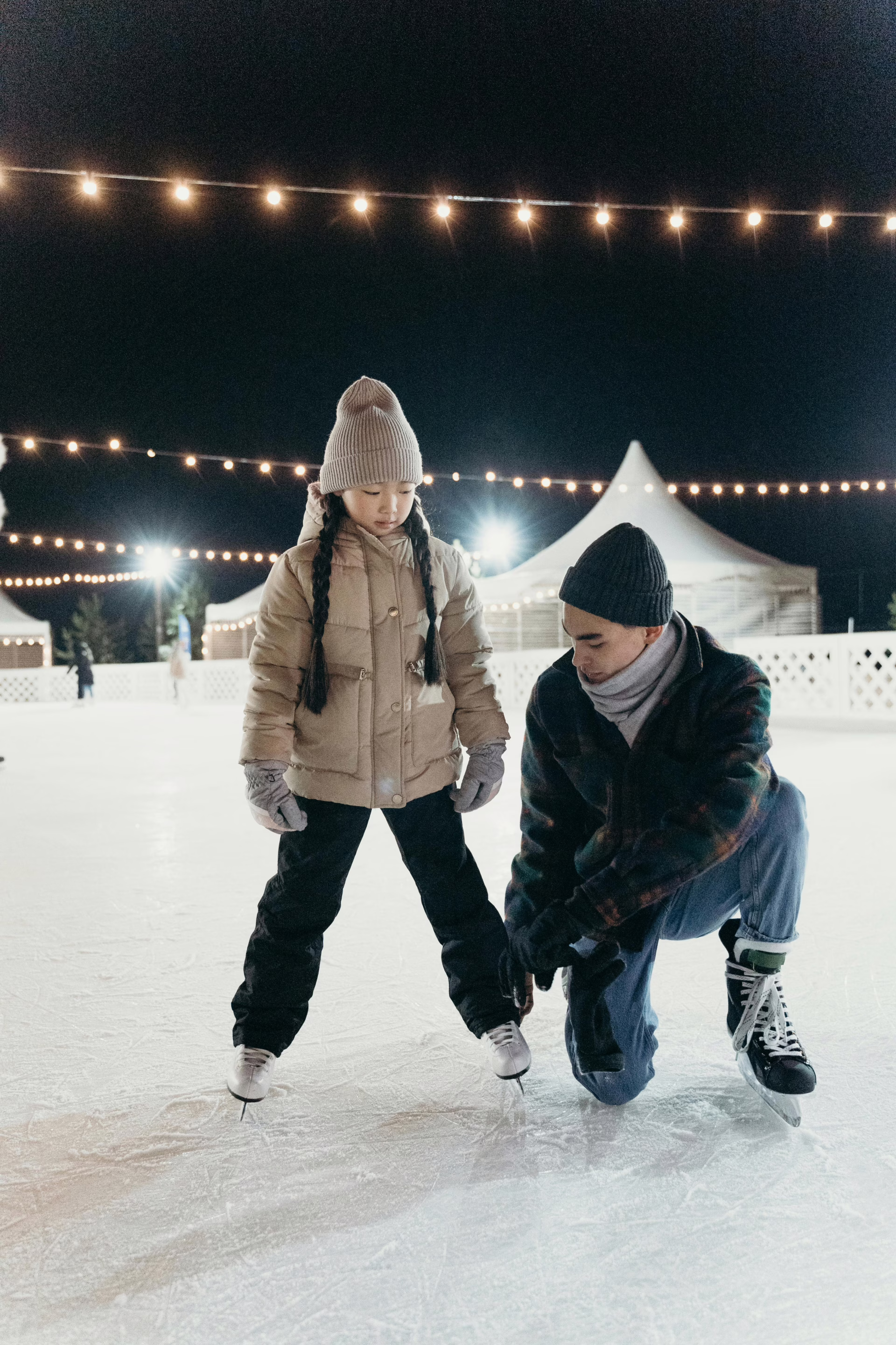 Father and Daughter Doing Ice Skating