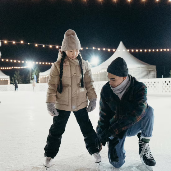 Father and Daughter Doing Ice Skating